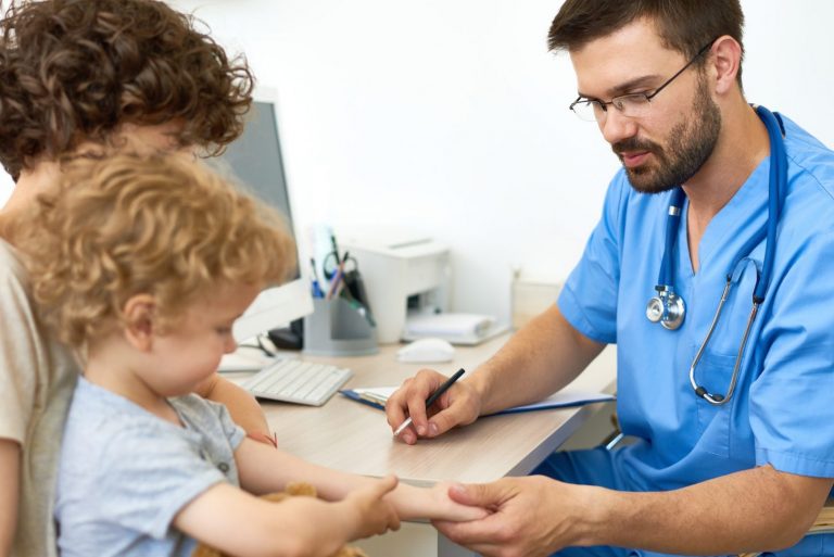 Pediatrician with Child in Office